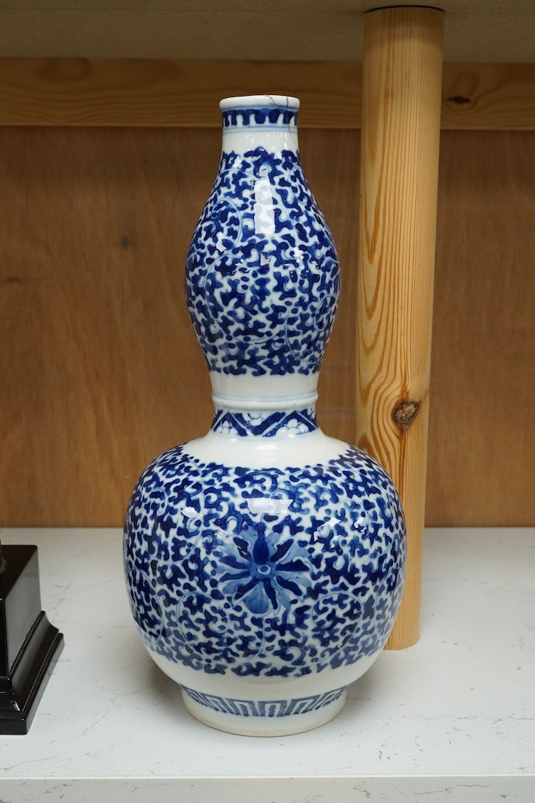 And early 20th century Chinese blue-and-white double gourd shaped vase, blue ring marks to the base, 29cm high